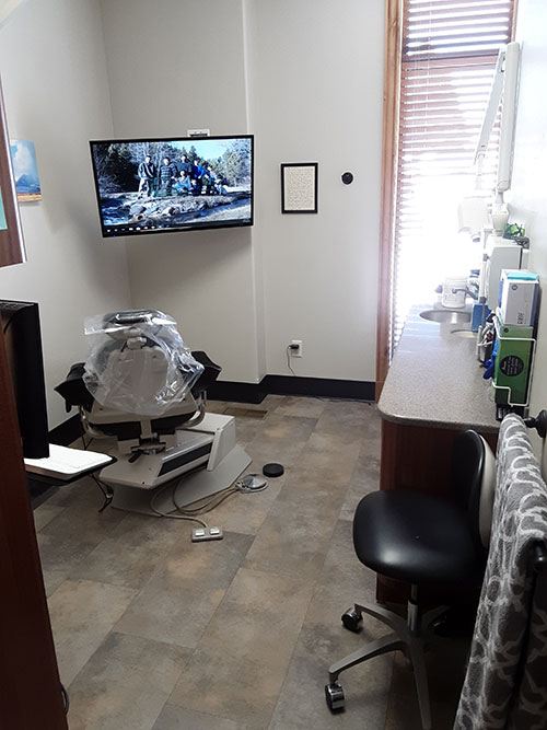 Suite Dental exam room with a large tv 2